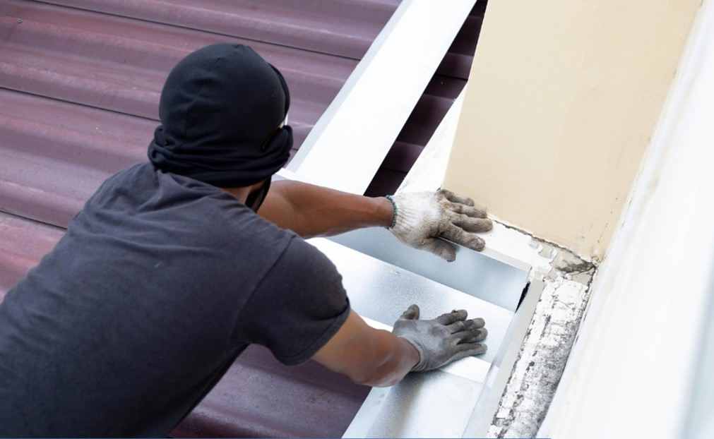 person doing roof leak repairs